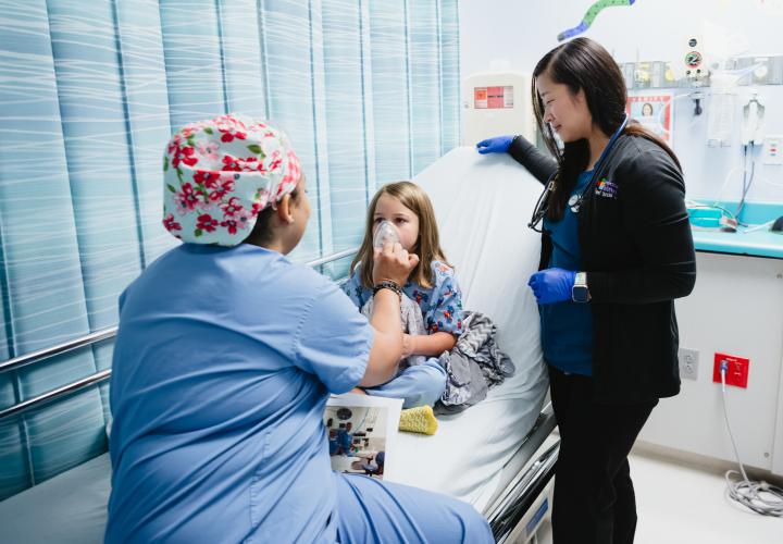 Team member interacting with a patient in pre-op.