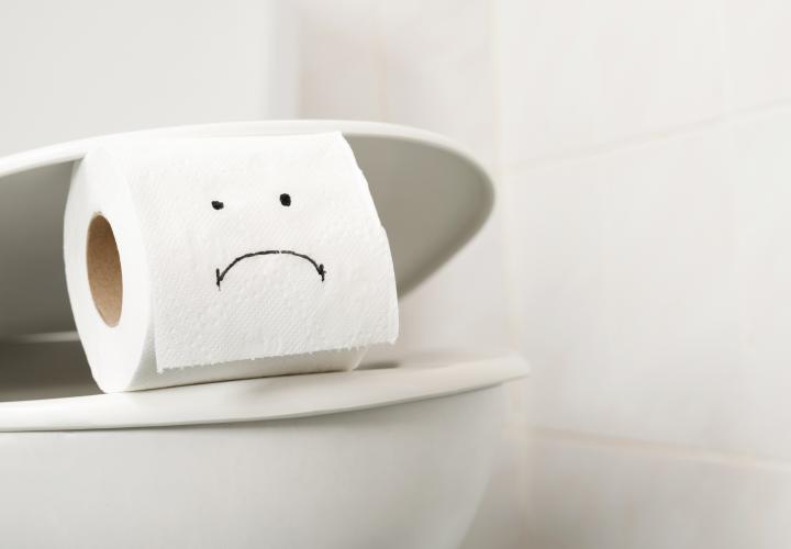 Toilet paper with sad face, maybe cyclosporiasis infection
