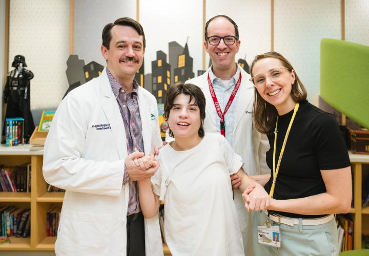 Deep brain stimulation patient with her doctors in the Family Resource Center