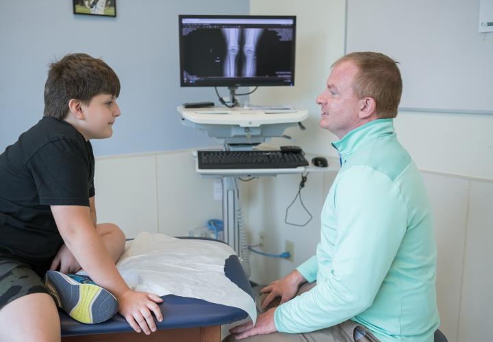 Provider treating Patient in Sports Medicine Department