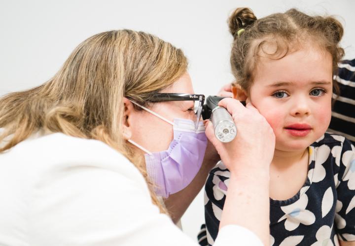 Dr. Wareham examines a patient in the ear, nose, and throat clinic at the Westport Specialty Care Center.
