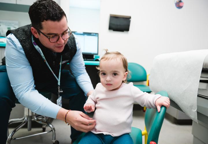 Dr. Salazar examines a gastroenterology patient in intestinal rehab clinic. Dr. Salazar examines a gastroenterology patient in intestinal rehab clinic.