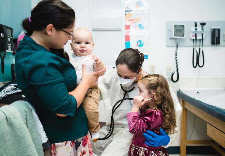 Dr. Collins examines a patient during a Primary Ciliary Dyskinesia clinic.
