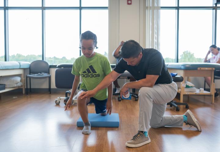 Provider treating Patient in Sports Medicine Department