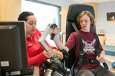 Sports Physical Therapy patient using return to sports equipment