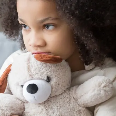 Girl holding a teddy bear 