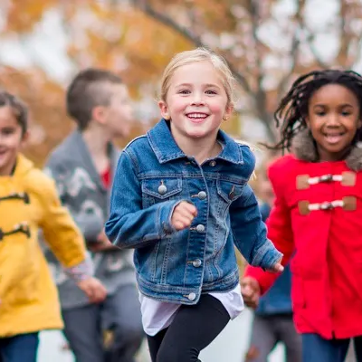 kids running in the snow