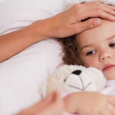 Mother taking care of her sick daughter