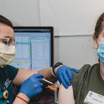 A teen getting a flu shot