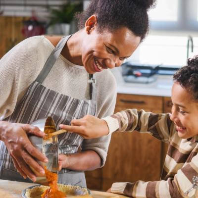 Mother and son baking together