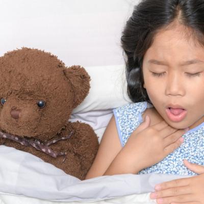 Young girl coughing