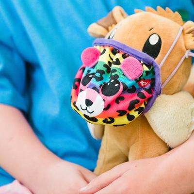 A child holds a stuffed animal