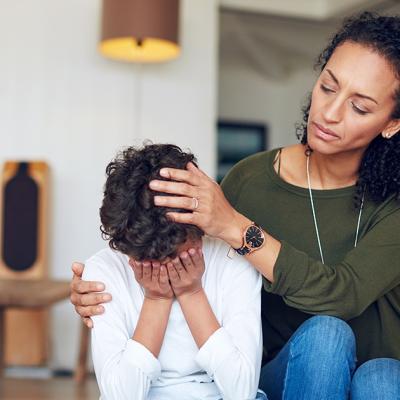 A mother comforts her child