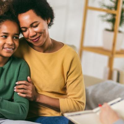 Mother and teenager daughter talk with therapist