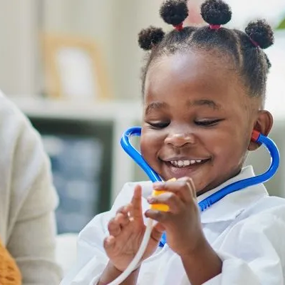 Girl wearing a stethoscope.