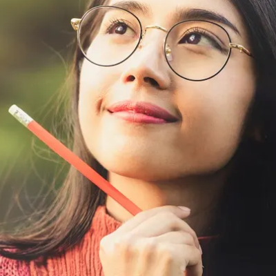 Young women holding a pencil