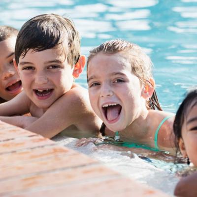 Young children playing in a pool