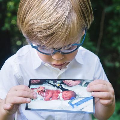 Jack holding his baby picture