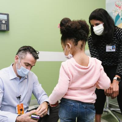 Jazz and her mom with a doctor at Connecticut Children's