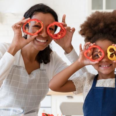 A mother and her daughter cook