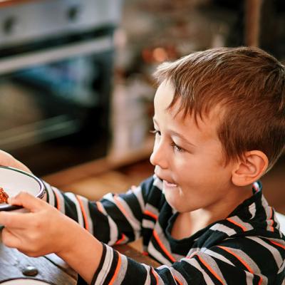 A child accepting a bowl of food