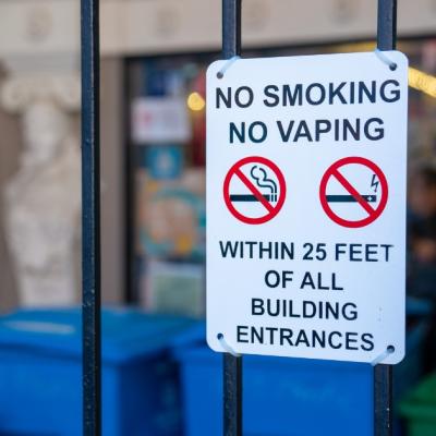 Sign that says "No smoking, no vaping within 25 feet of all building entrances"