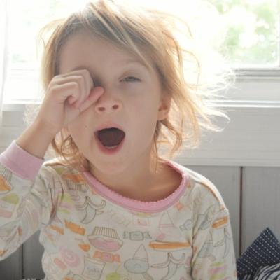 Young girl yawning