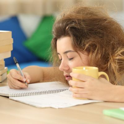 Exhausted college student passing out on homework