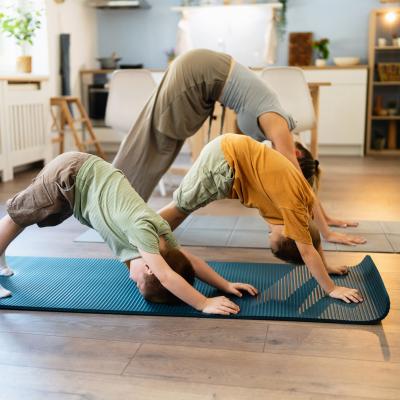 Family doing yoga together. 