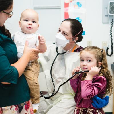 Dr. Collins of Connecticut Children's examines a patient during Primary Ciliary Dyskinesia clinic