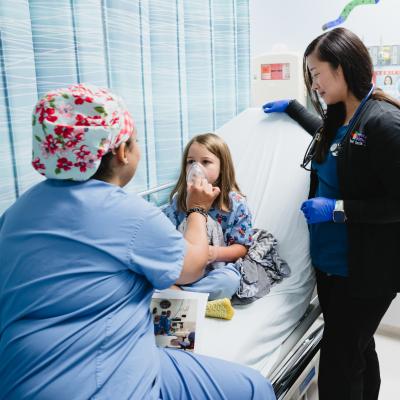 Team member interacting with a patient in pre-op.