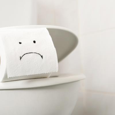 Toilet paper with sad face, maybe cyclosporiasis infection