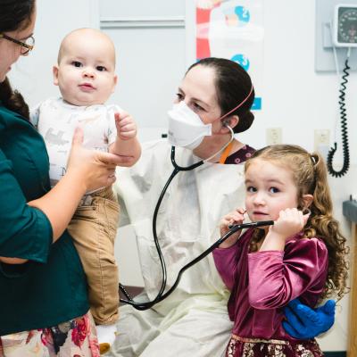 Dr. Collins examines a patient during a Primary Ciliary Dyskinesia clinic.