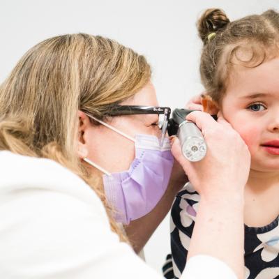 Dr. Wareham examines a patient in the ear, nose, and throat clinic at the Westport Specialty Care Center.
