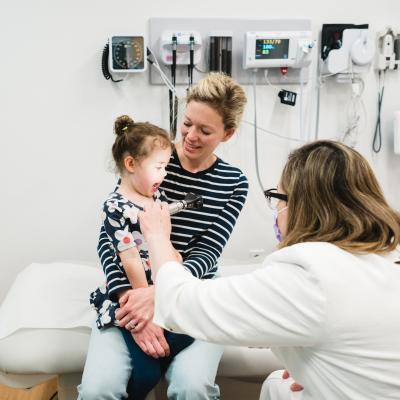 Dr. Wareham examines a patient in the ear, nose, and throat clinic at the Westport Specialty Care Center.