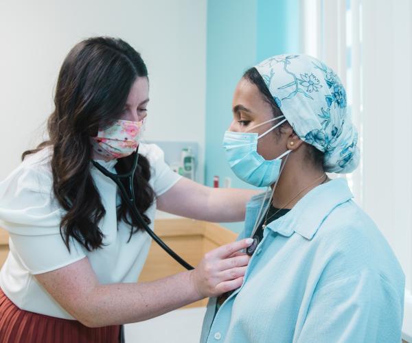Provider examining patient in Cardiology department