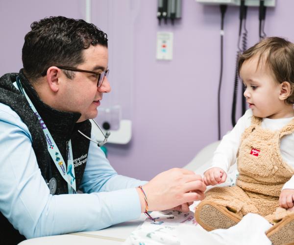 Dr. Salazar examines a gastroenterology patient in intestinal rehab clinic.