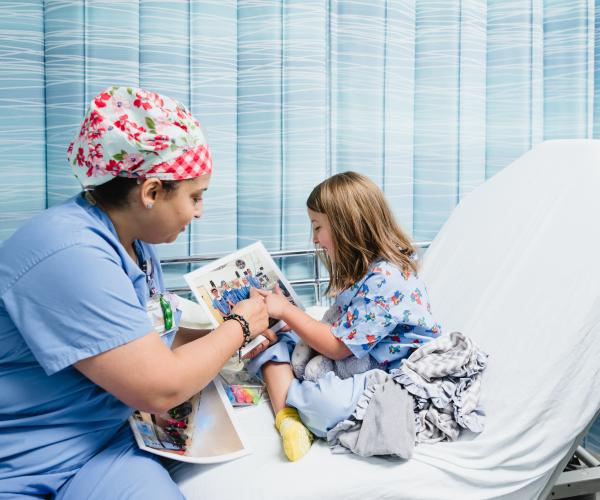Team member interacting with a patient in pre-op.