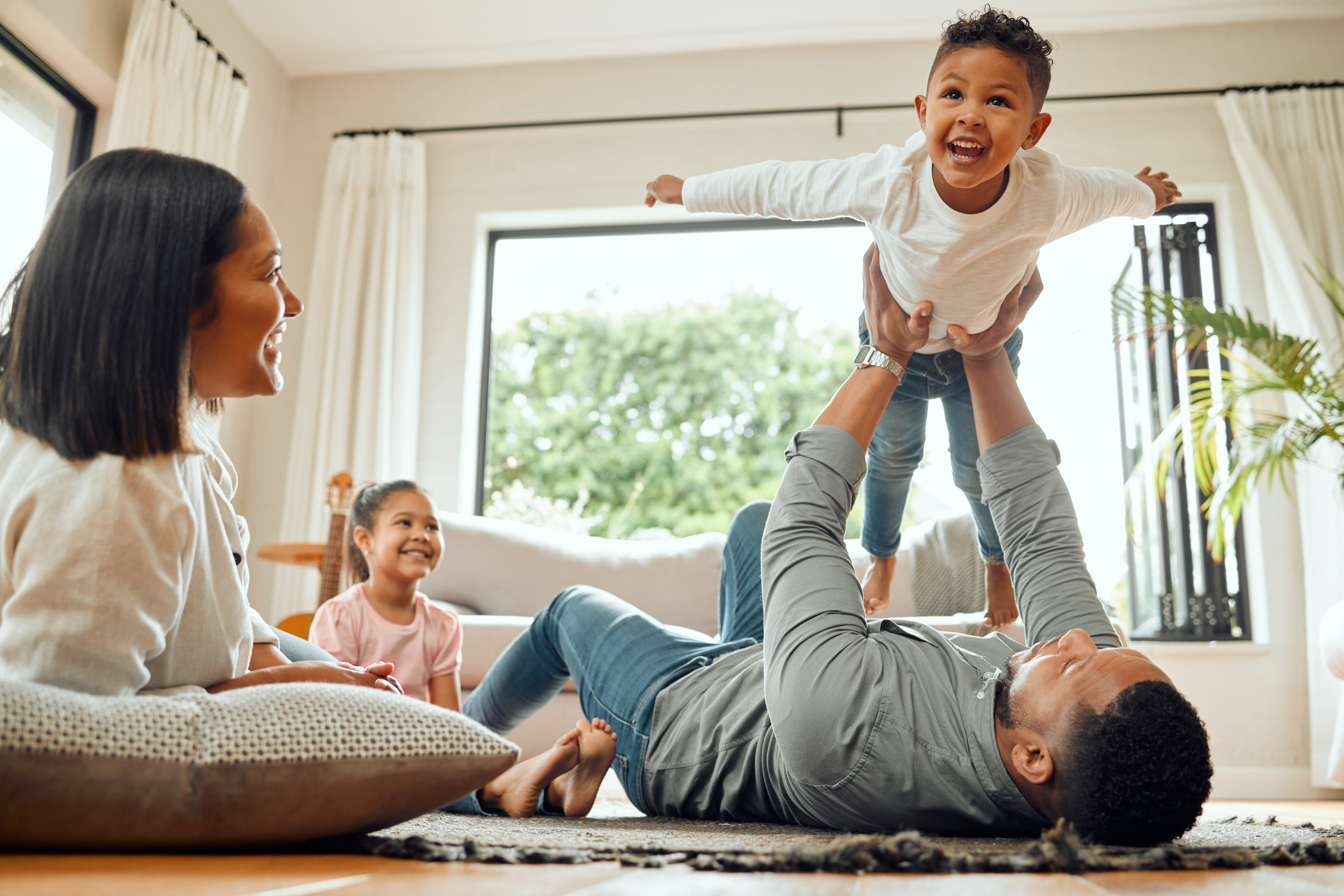 Family playing in home.