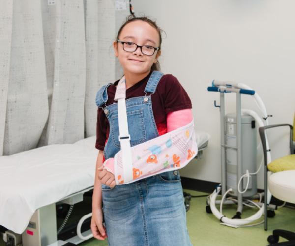 Girl with a cast on her arm